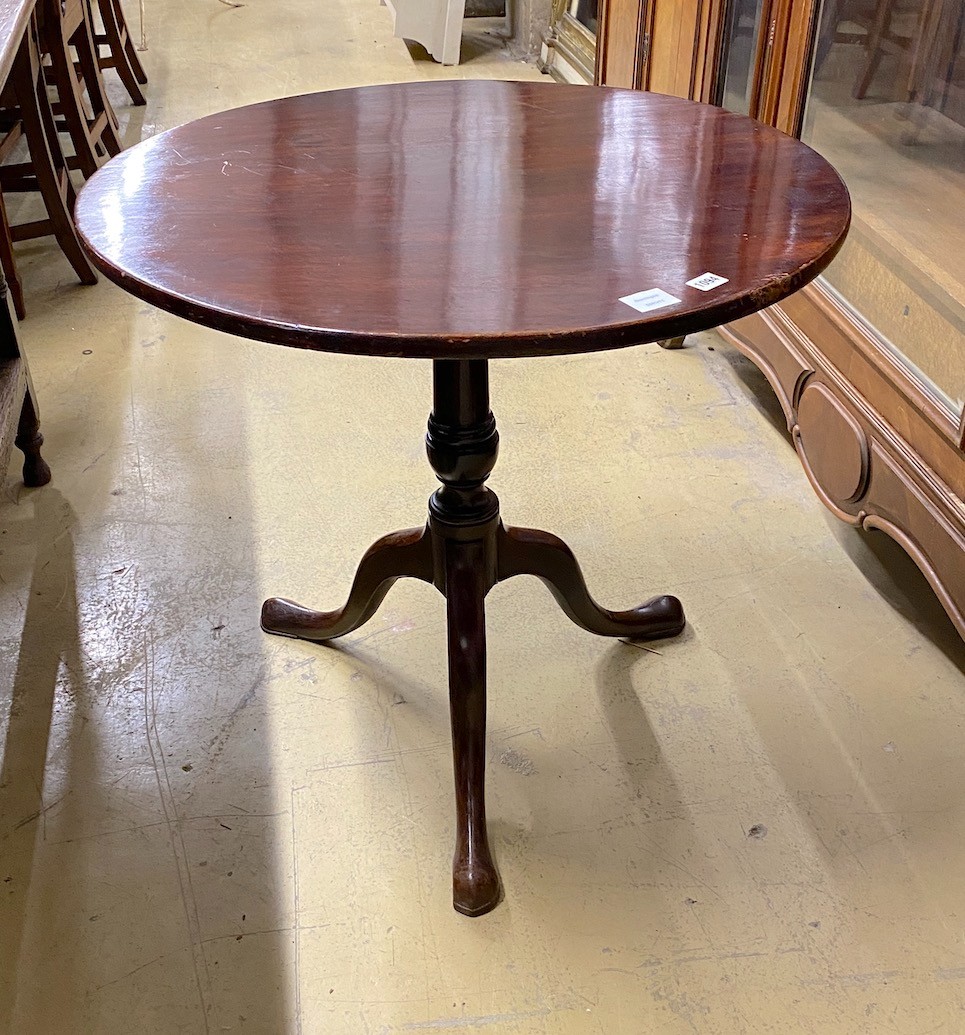 A George III circular mahogany tilt top tripod tea table, diameter 76cm, height 69cm